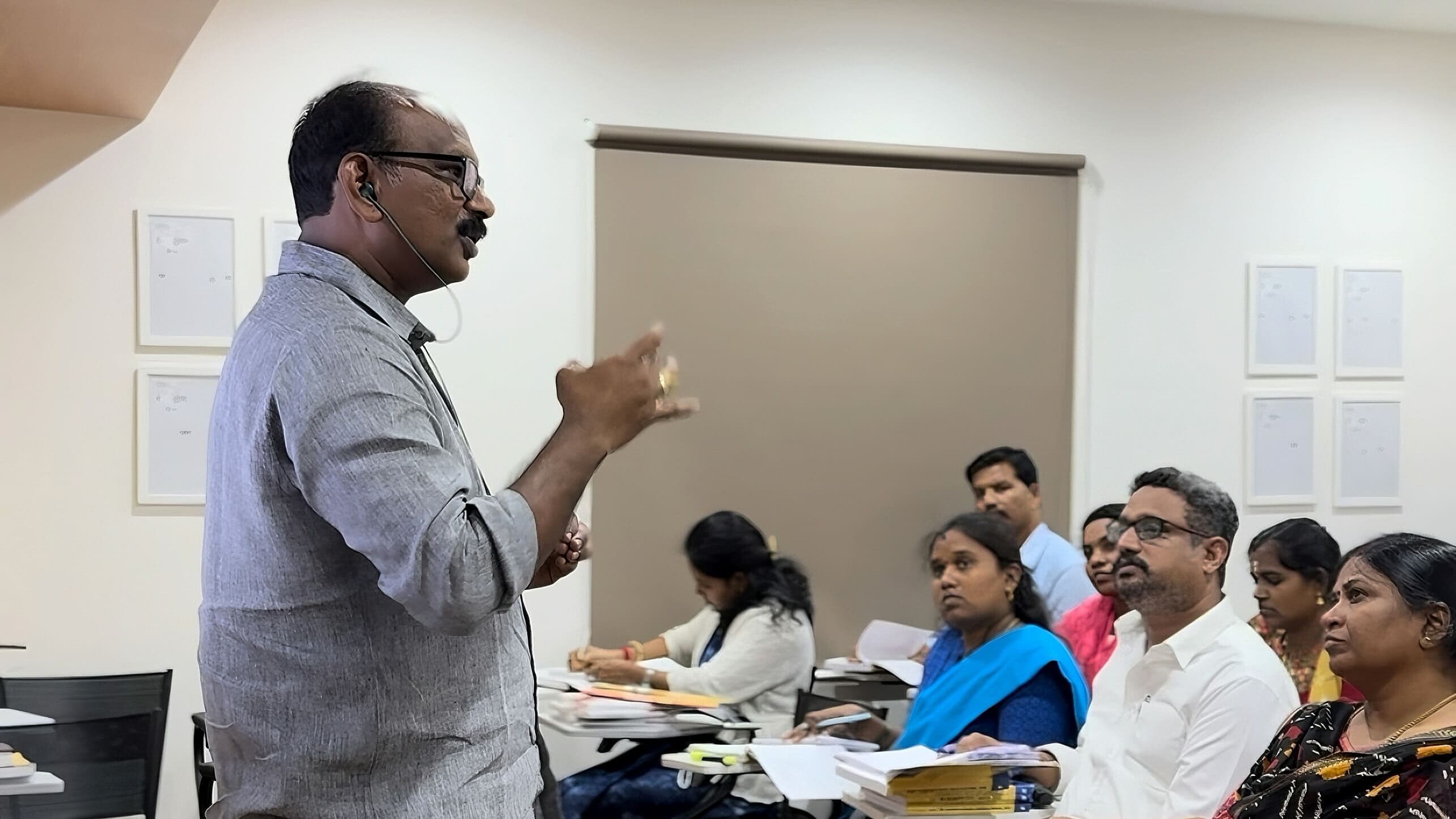 Faculty member explaining a point to a classroom of law learners at VLS Law Academy